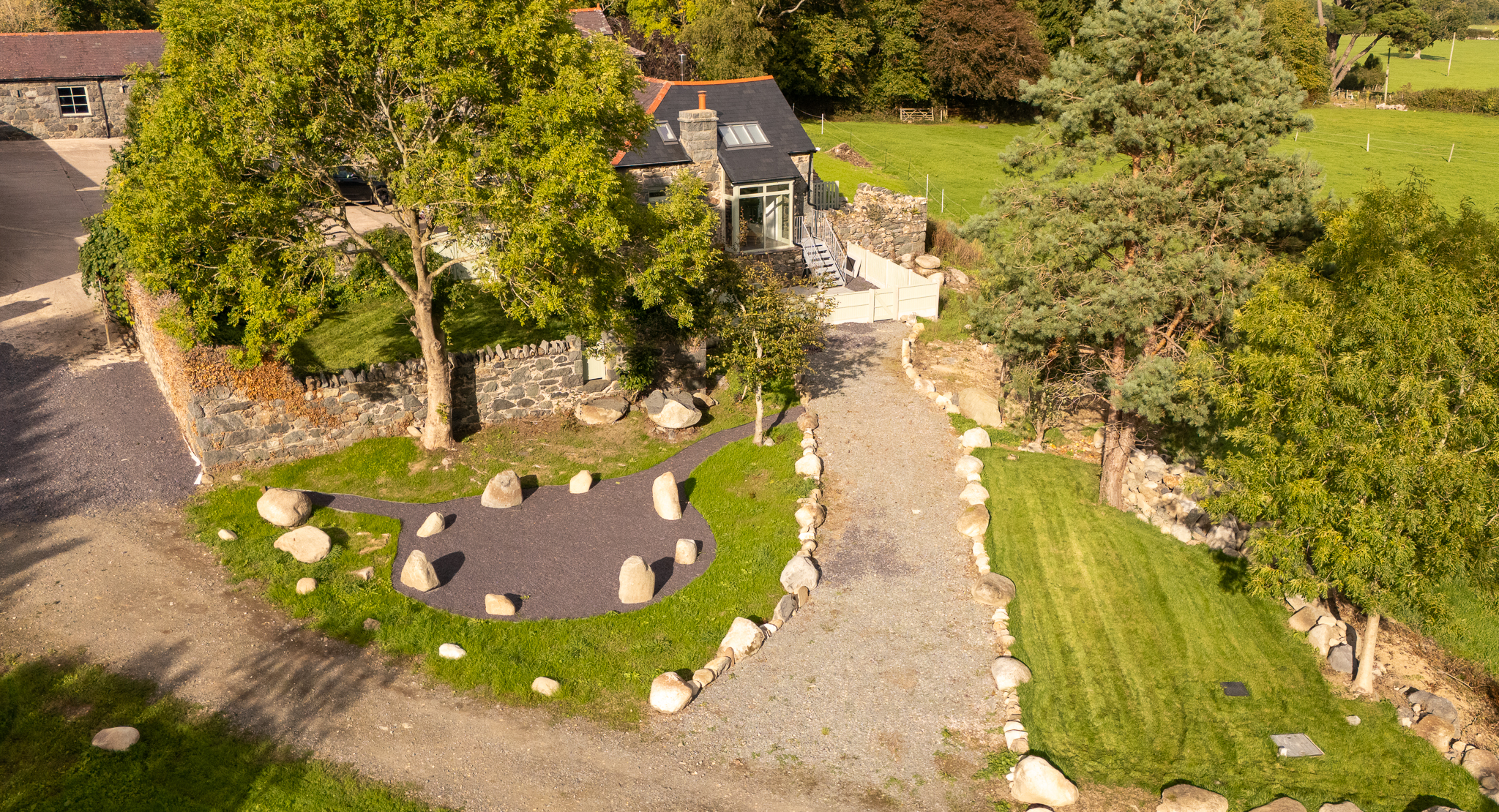 The stone circle and cottage grounds seen from above